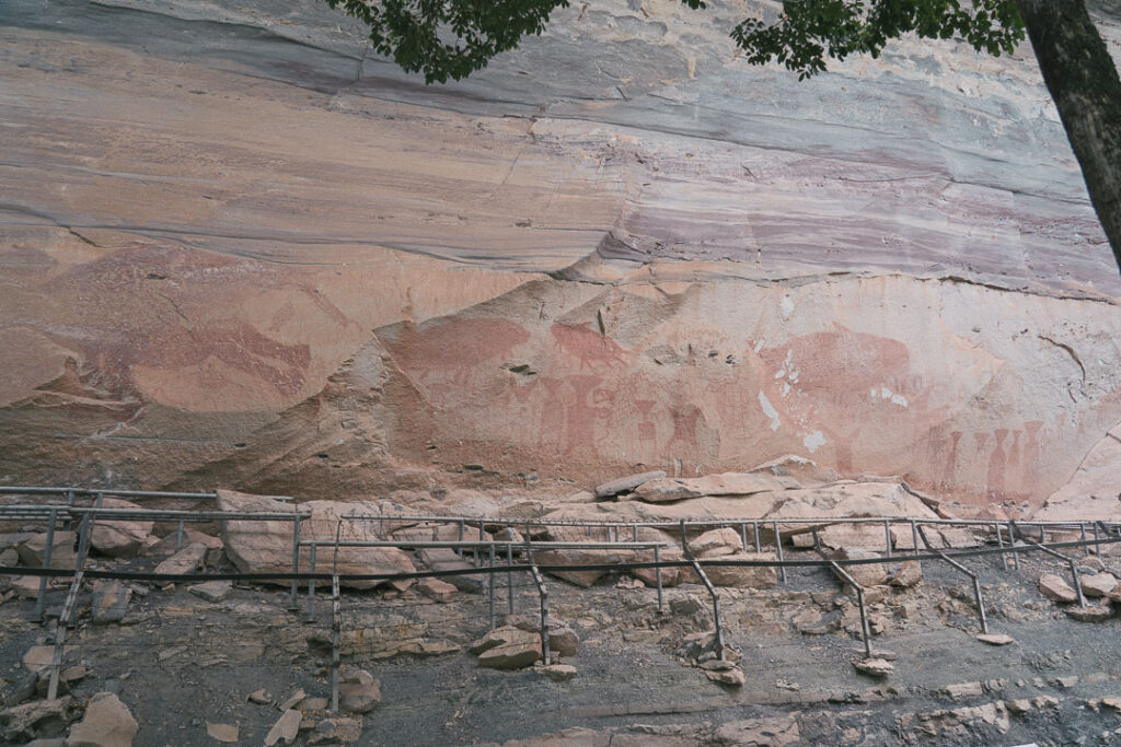Panoramic view of rock art scattered across Pha Taem cliff
